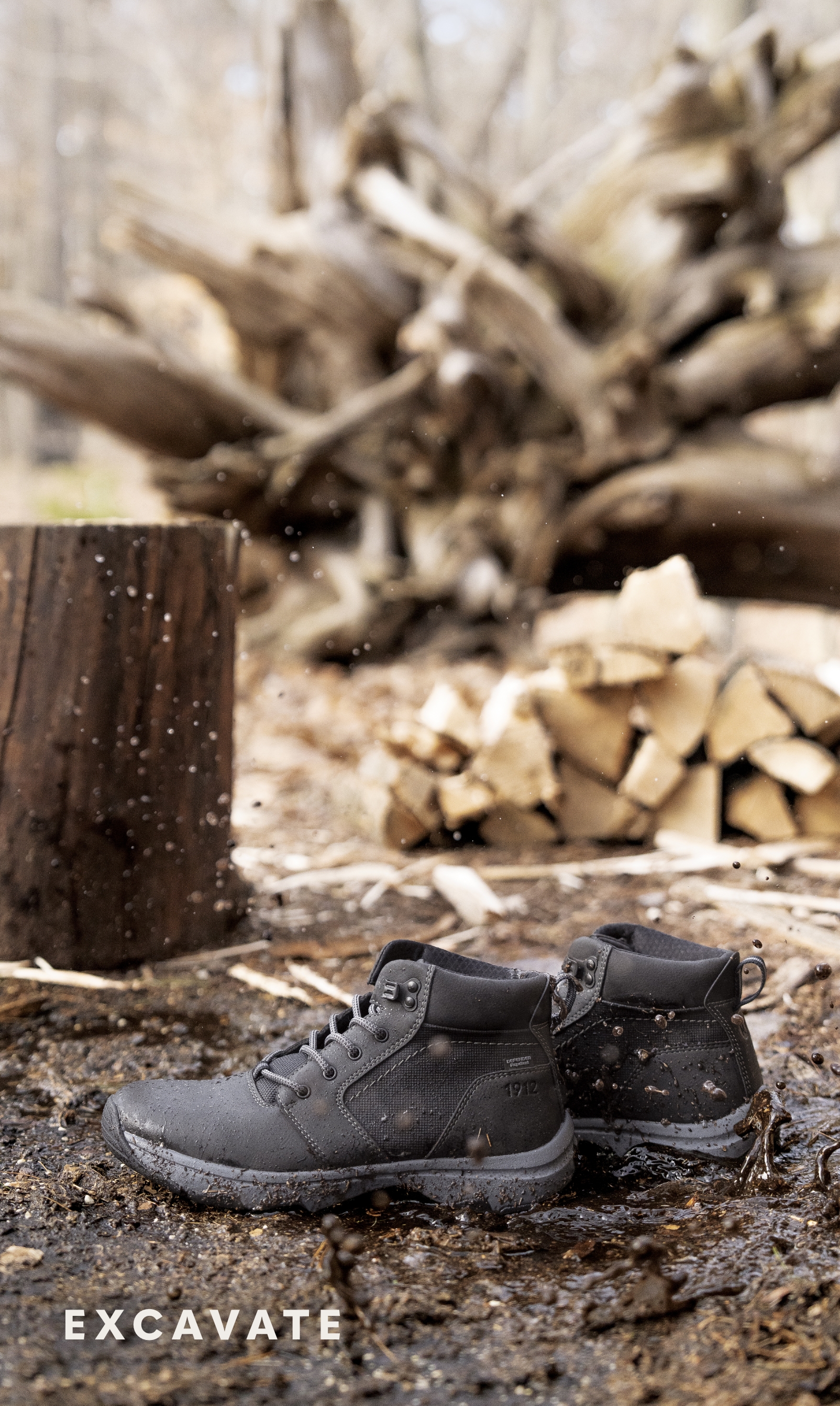 Shoes for Men view all category. Image features the Excavate boot in grey. 