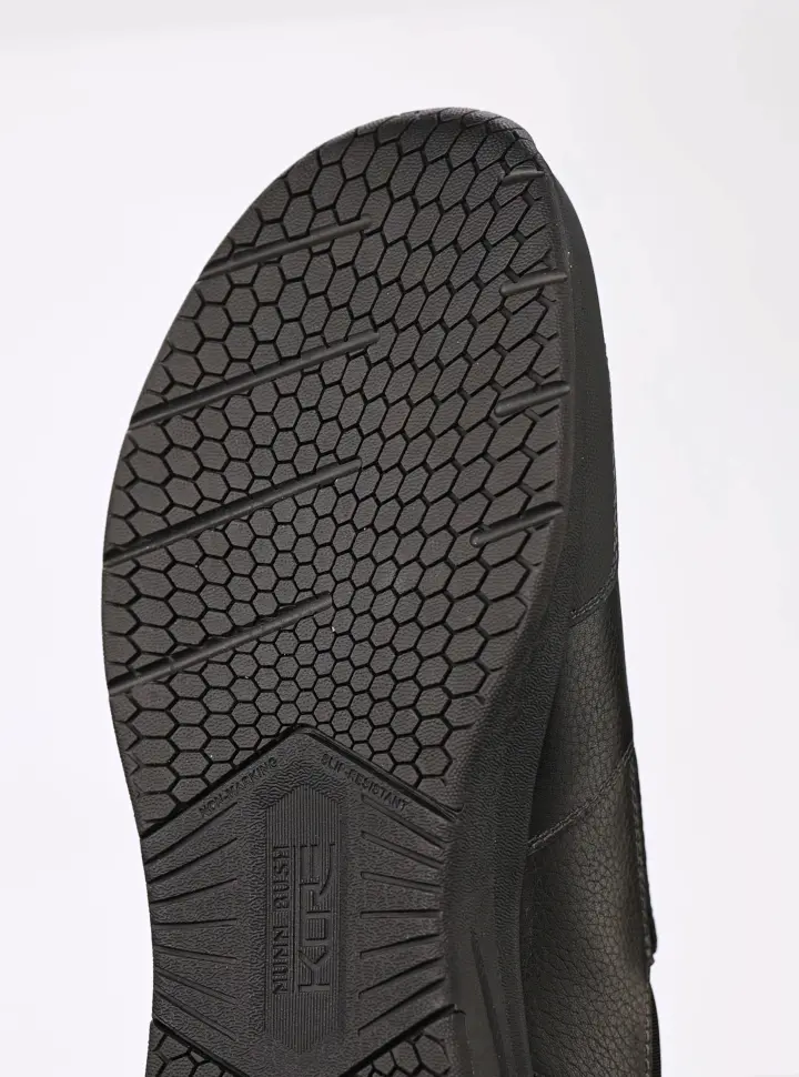 Gif features the slip-resistant rubber sole on the KORE Taz EZ Moc Toe Slip On.