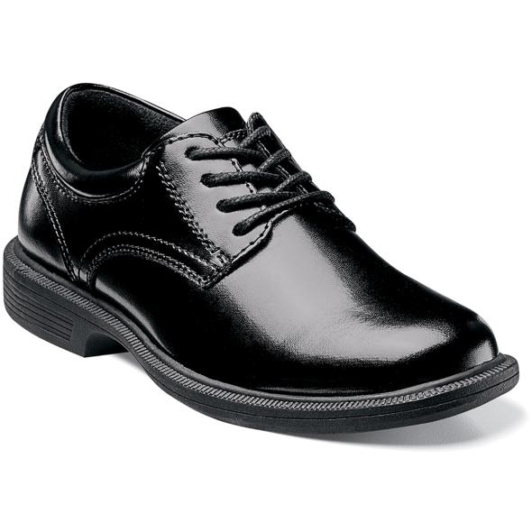 The Baker St. Jr. is a plain toe lace-up. This shoe has a smooth man-made upper. The linings are breathable fabric. Our Dual Comfort technology is a unique combination of two foam compounds that you have to feel for yourself to believe. The top most layer is created from memory foam, which forms to your foot for instant comfort. The bottom layer is created from an open cell foam that absorbs the pressure of each step and provides all-day comfort. Our KORE dual density outsole is biomechanically designed for walking. The midsole is created from a lightweight walkable EVA and provides athletic inspired comfort and shock absorption. The outsole is created from a slip-resistant rubber compound that adds traction and durability. Combined with an aggressive rolling impact zone of the heel, these shoes are made for walking. The sole is non-marking, slip-resistant rubber. This is a child's size shoe, not an adult style