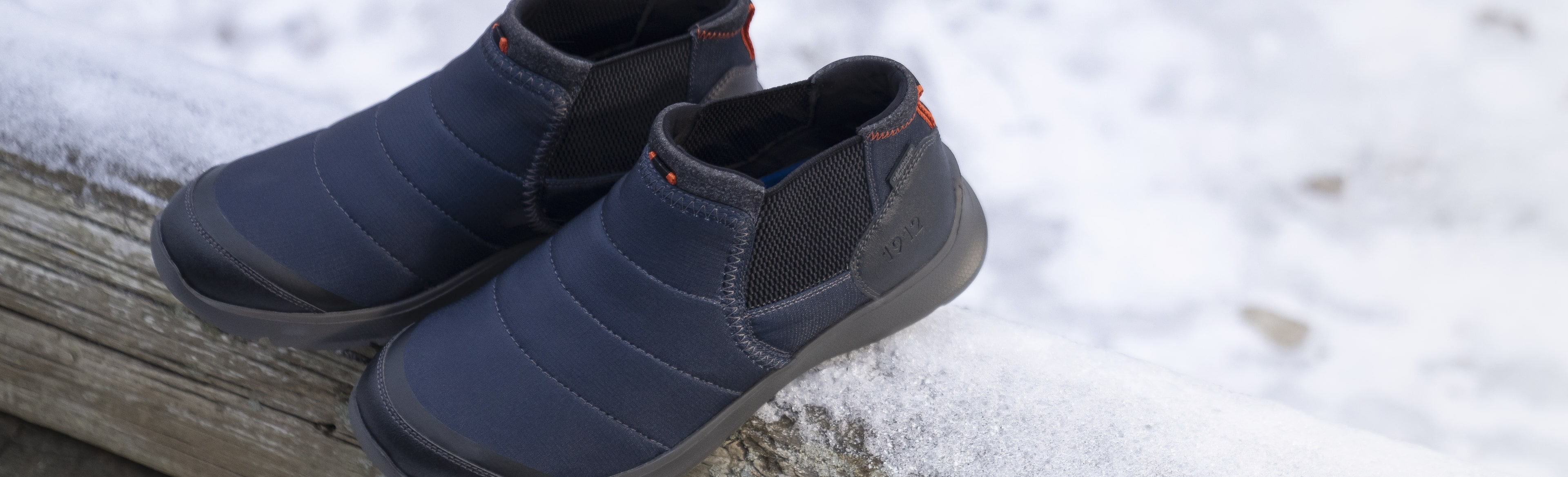Click to shop our holiday gift guide! Image features the Bushwacker boot in navy. 