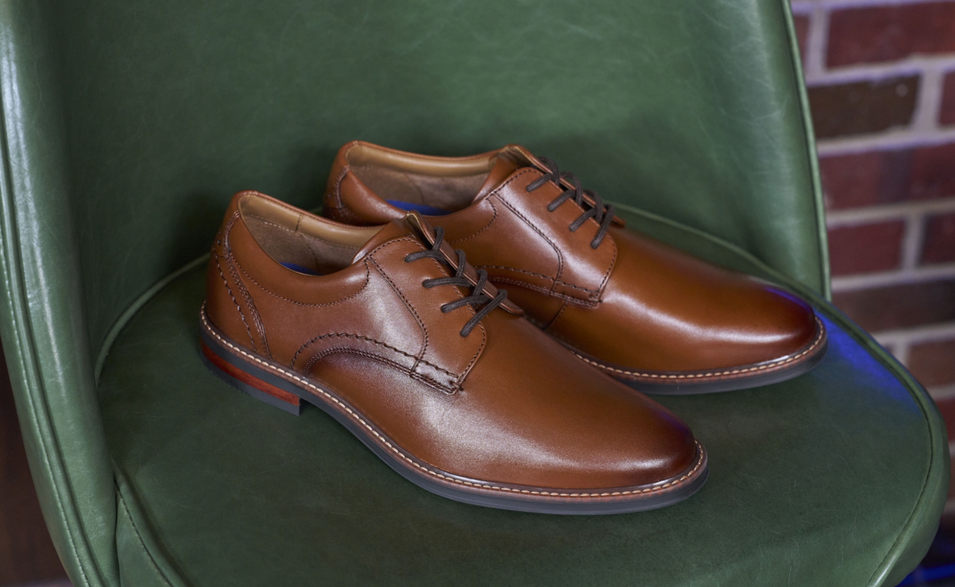 Click to shop Nunn Bush dress shoes. Image features the Carmelo in cognac.