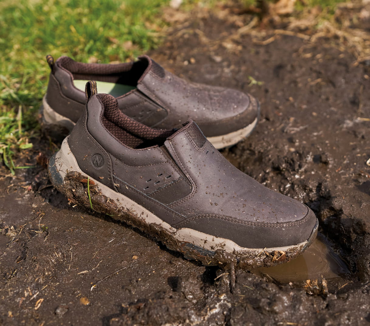 Shop the KORE Cliffside featuring the slip on in a mud puddle.