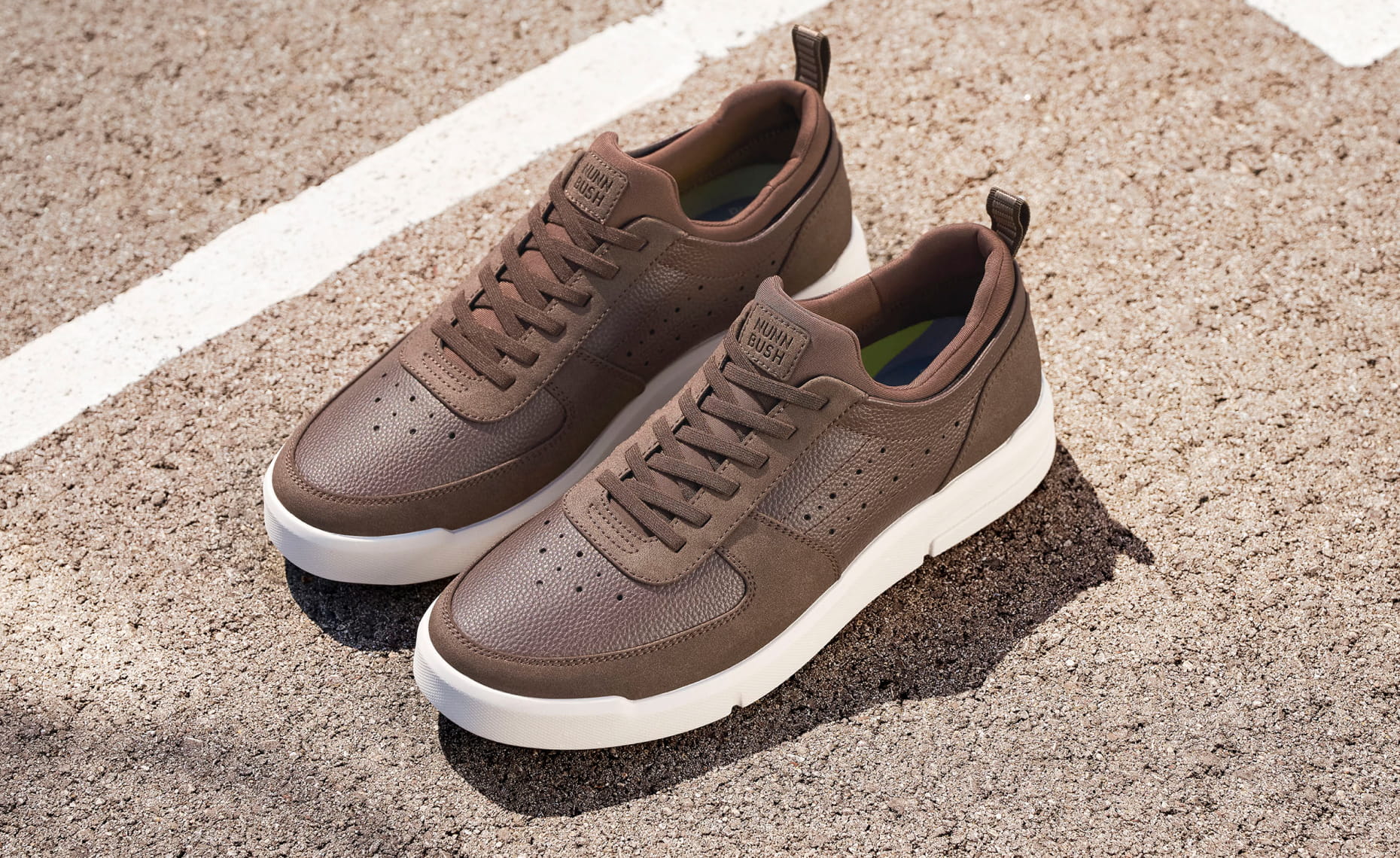 Shop Nunn Bush Casual featuring the KORE City Rally Moc Toe Sneaker in Brown Multi in a parking lot.