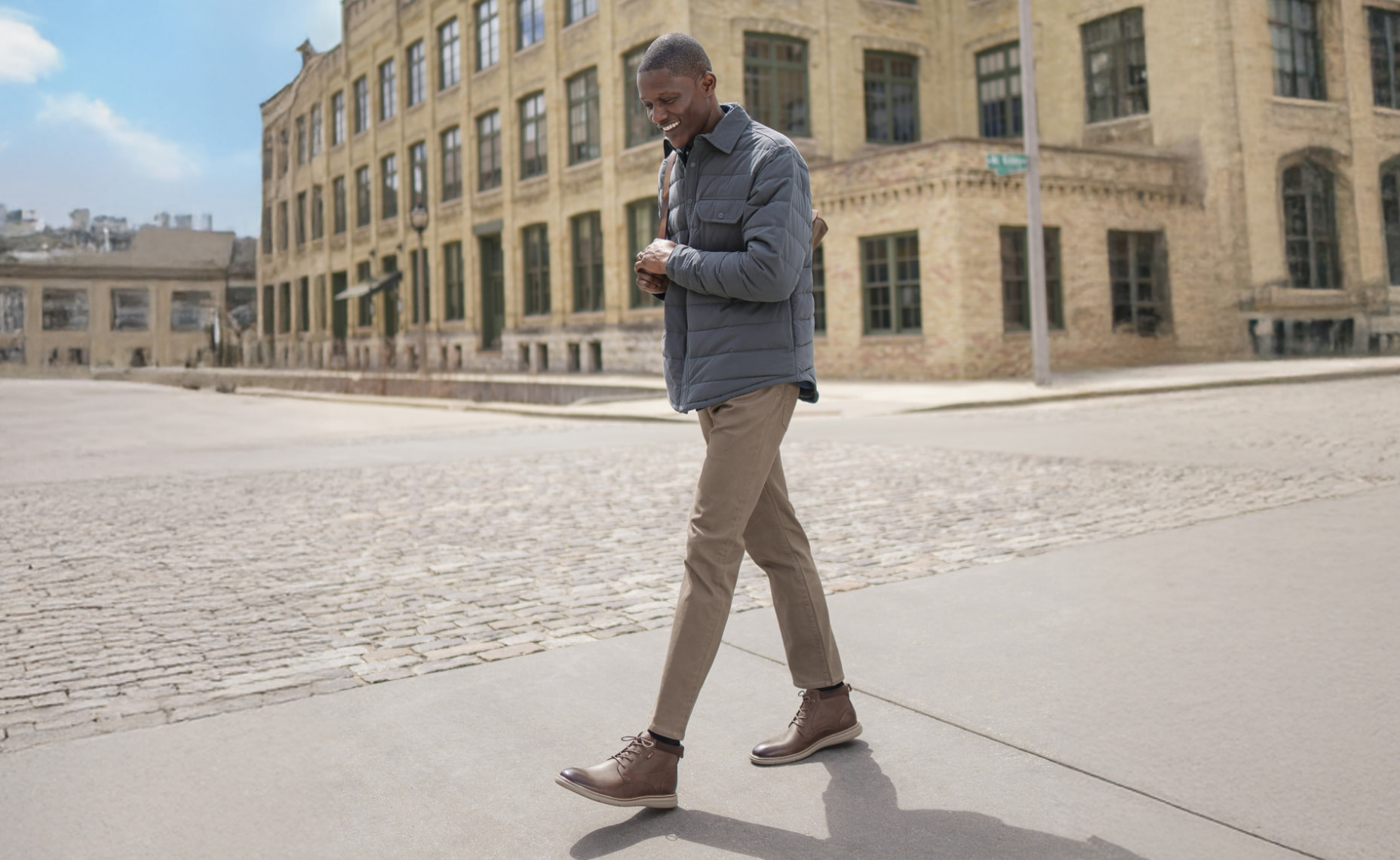 Shop our best selling Chase collection featuring the Chase chukka boot in front of a brick building. 