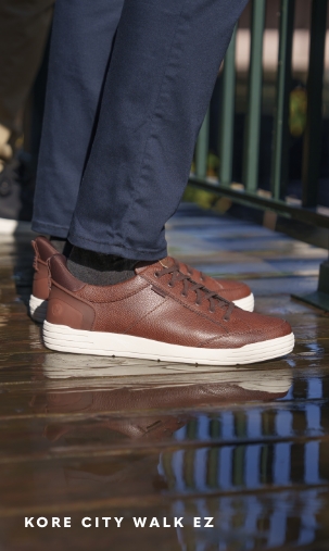 Men's Casual Shoes category. Image features the Kore City Walk EZ sneaker in cognac.