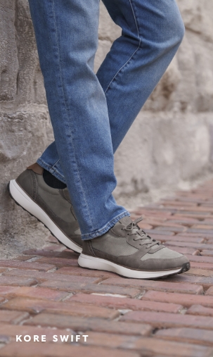 Shoes for Men view all category. Image features the Kore Swift sneaker in gray on a brick street.