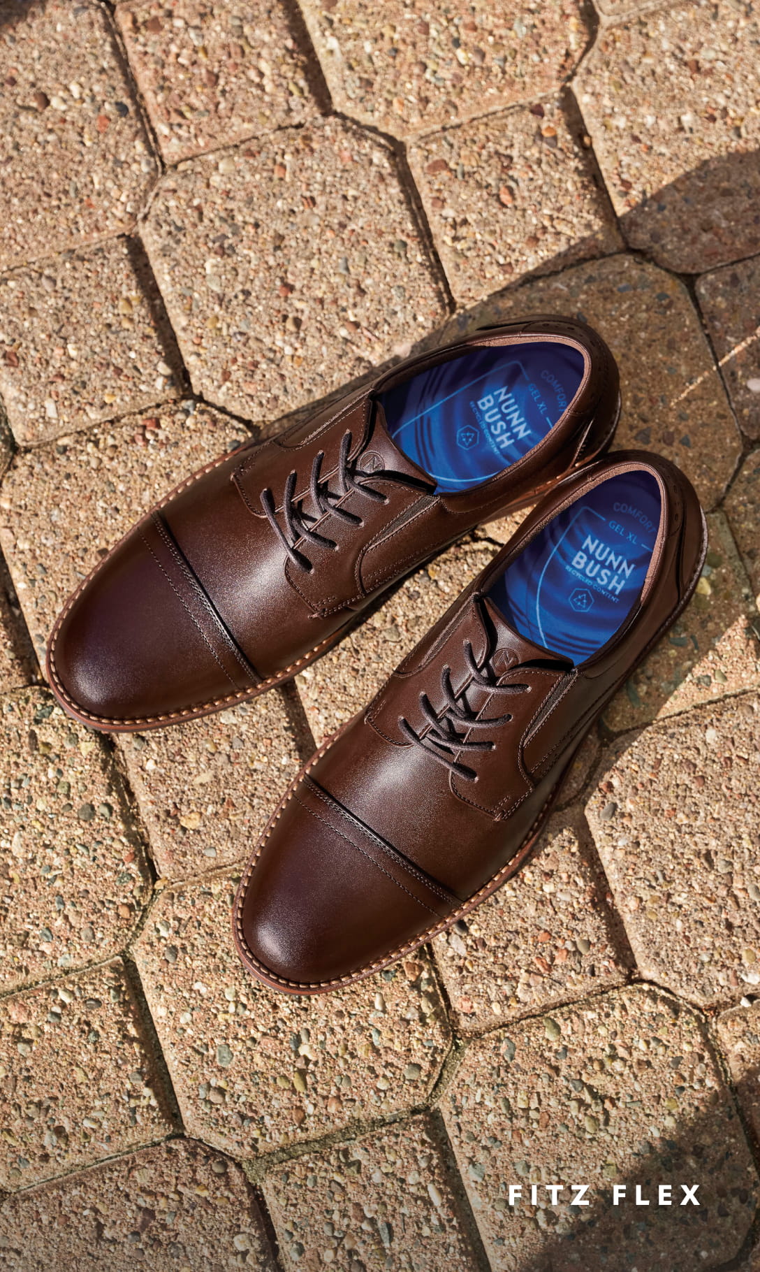 Men's Dress Shoes category. Images features the Fitz Flex Cap Toe Oxford in Brown on brick floors.